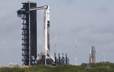 NASA SLS and SpaceX Falcon 9 at Launch Pads